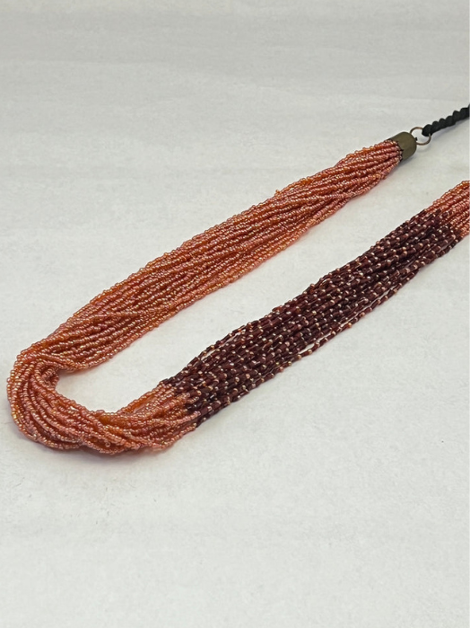 ORANGE BROWN SEED BEAD WITH THREAD BRAIDED NECKLACE