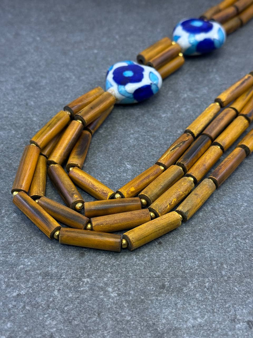 HORN PIPE & CERAMIC BEAD WITH GOLD METAL BOLL & THREAD BRAIDED NECKLACE