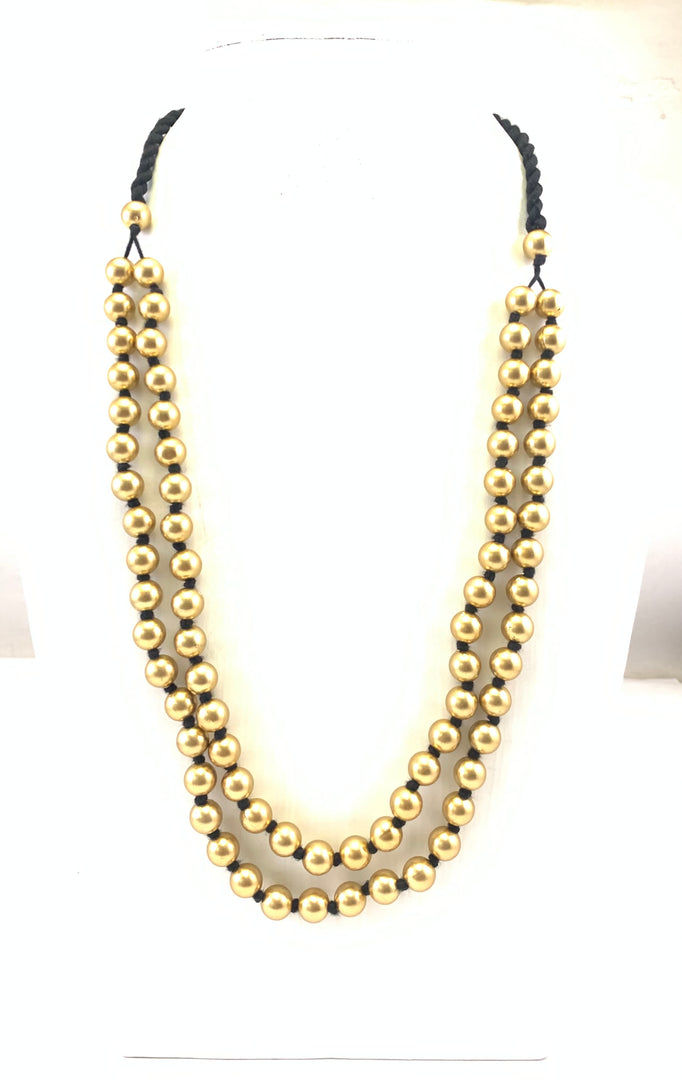 NK15112A - PLASTIC BEAD WITH BRAIDED THREAD NECKLACE