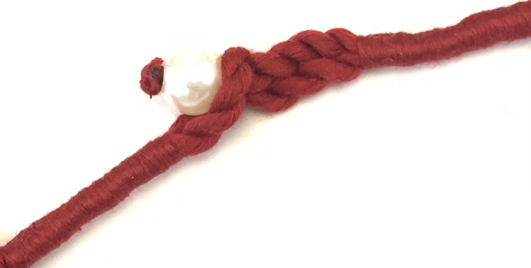 NK15012B - MULTI LAYERED SEED/PLASTIC PEARL BEAD WITH BRAIDED THREAD TAI NECKLACE